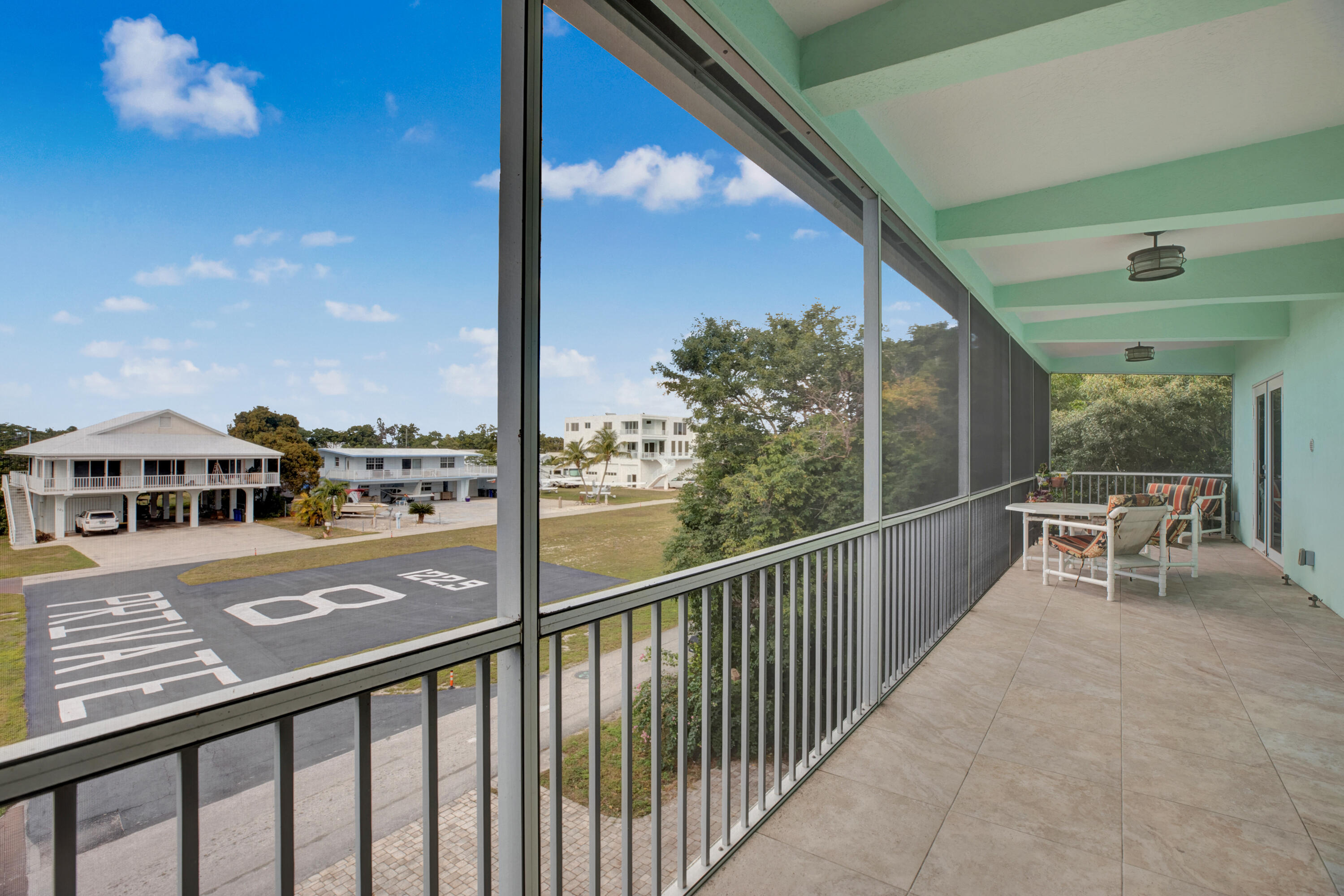 100 South Airport Road Tavernier, FL 33070 - Photo 33 of 42 a view of a balcony with chairs
