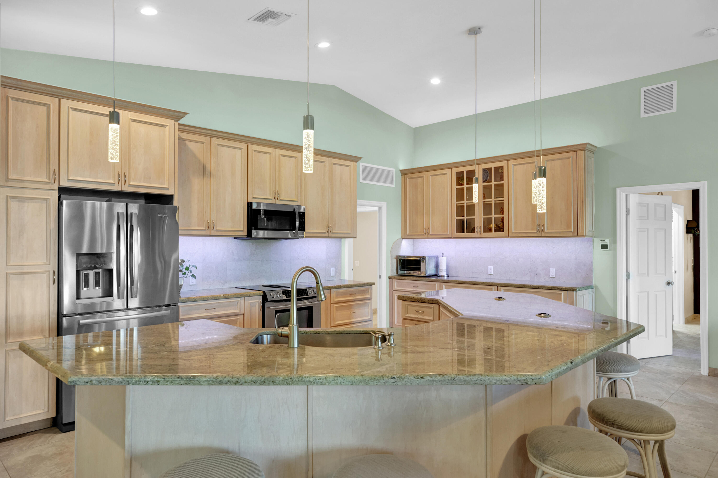 100 South Airport Road Tavernier, FL 33070 - Photo 7 of 42 a kitchen with stainless steel appliances granite countertop a sink and a refrigerator