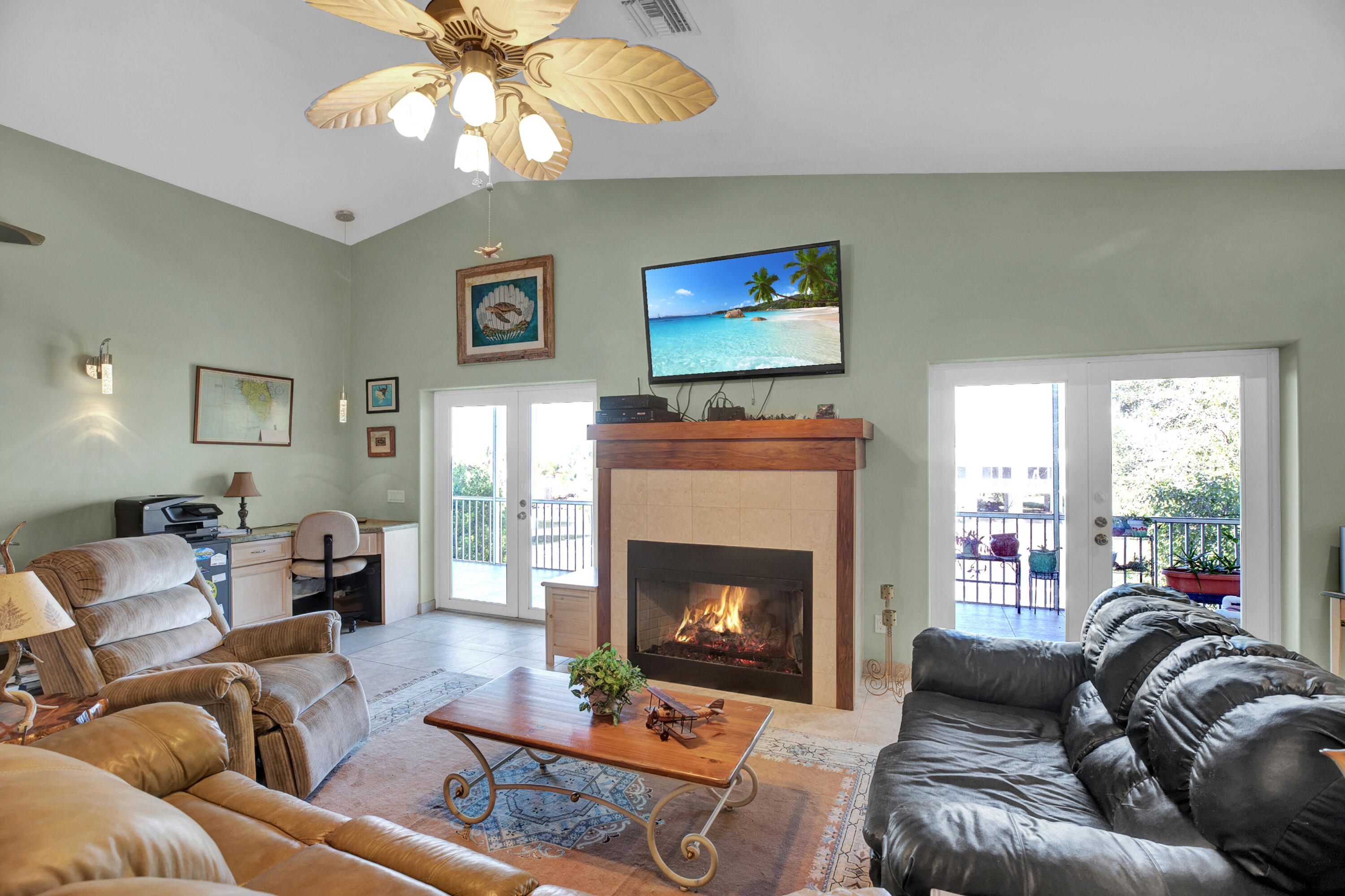 100 South Airport Road Tavernier, FL 33070 - Photo 9 of 42 a living room with furniture fireplace and a large window