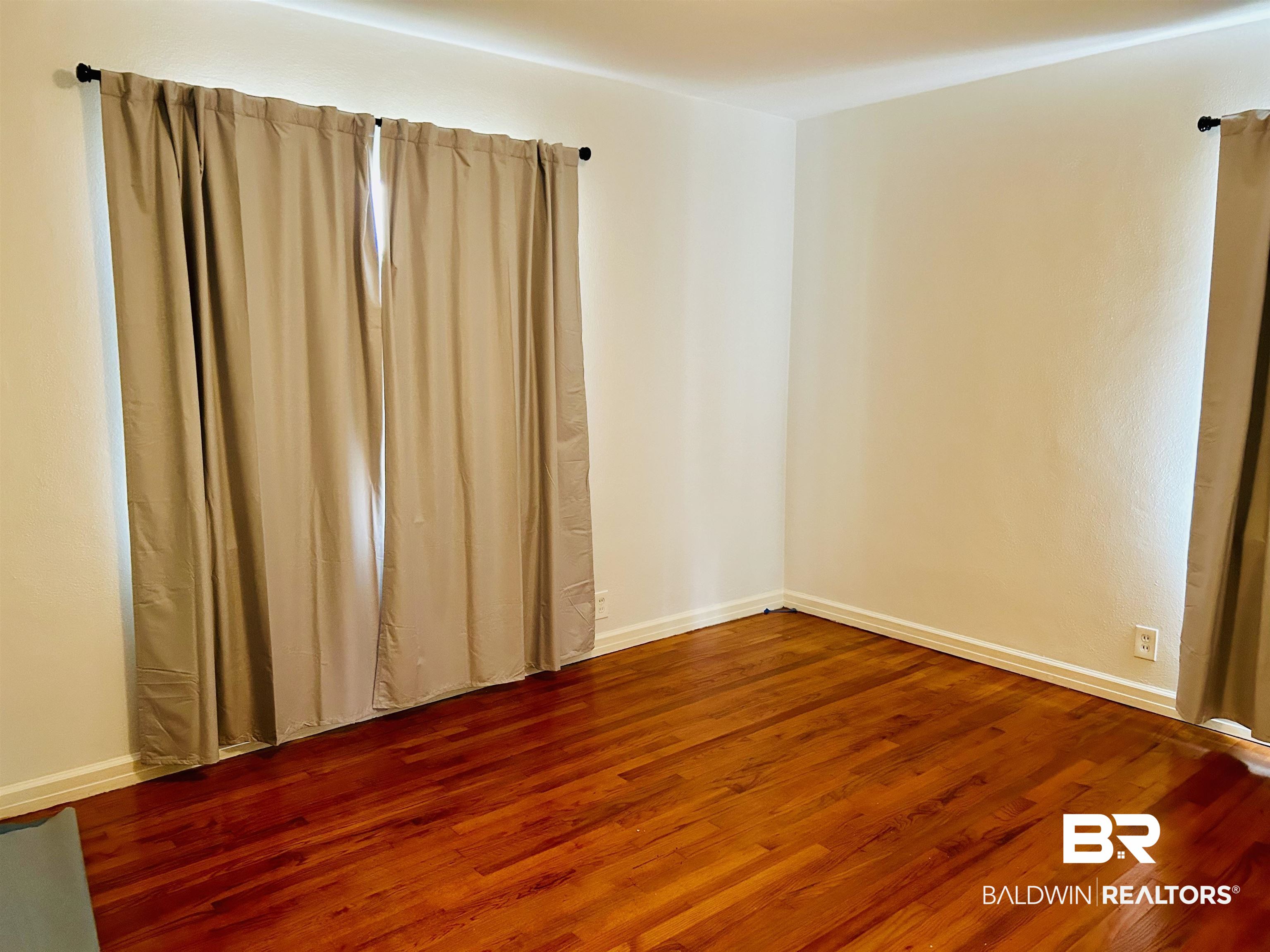 94 Diamond Street Mobile, AL 36611 - Photo 5 of 30 Unfurnished room with hardwood / wood-style floors