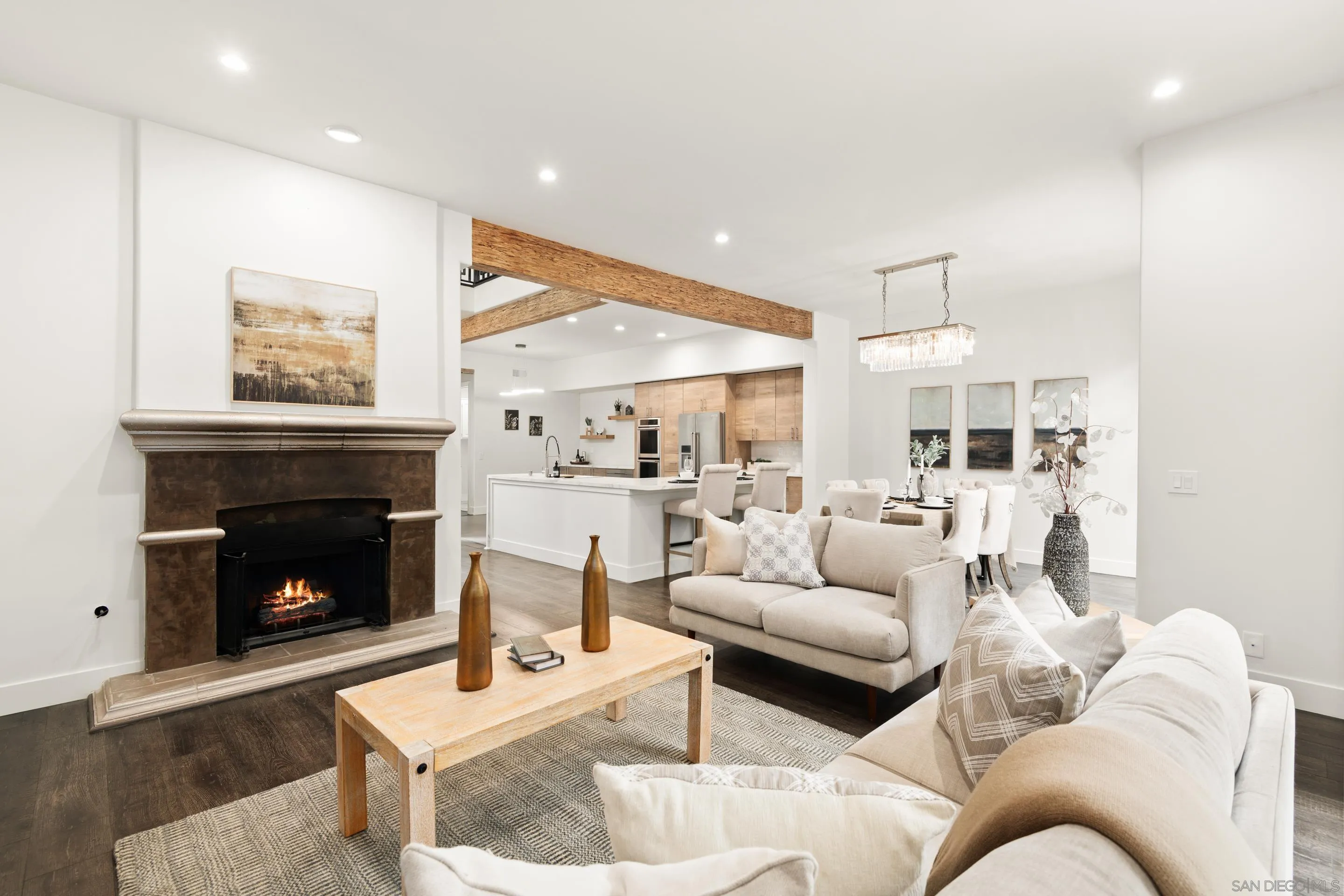 9767 Claiborne Square La Jolla, CA 92037 - Photo 11 of 50 a living room with furniture and a fireplace