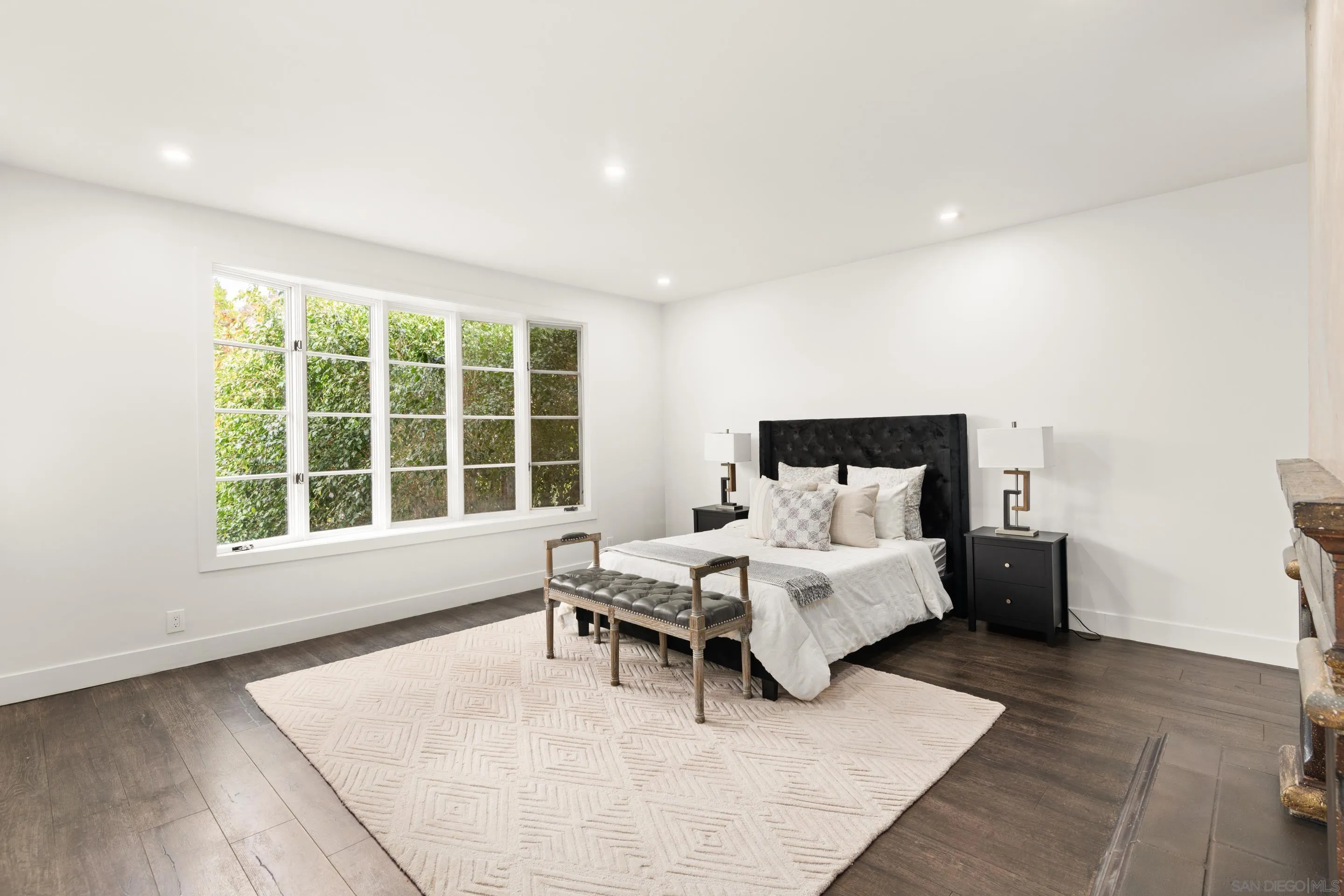 9767 Claiborne Square La Jolla, CA 92037 - Photo 17 of 50 a bed room with a bed and a large window