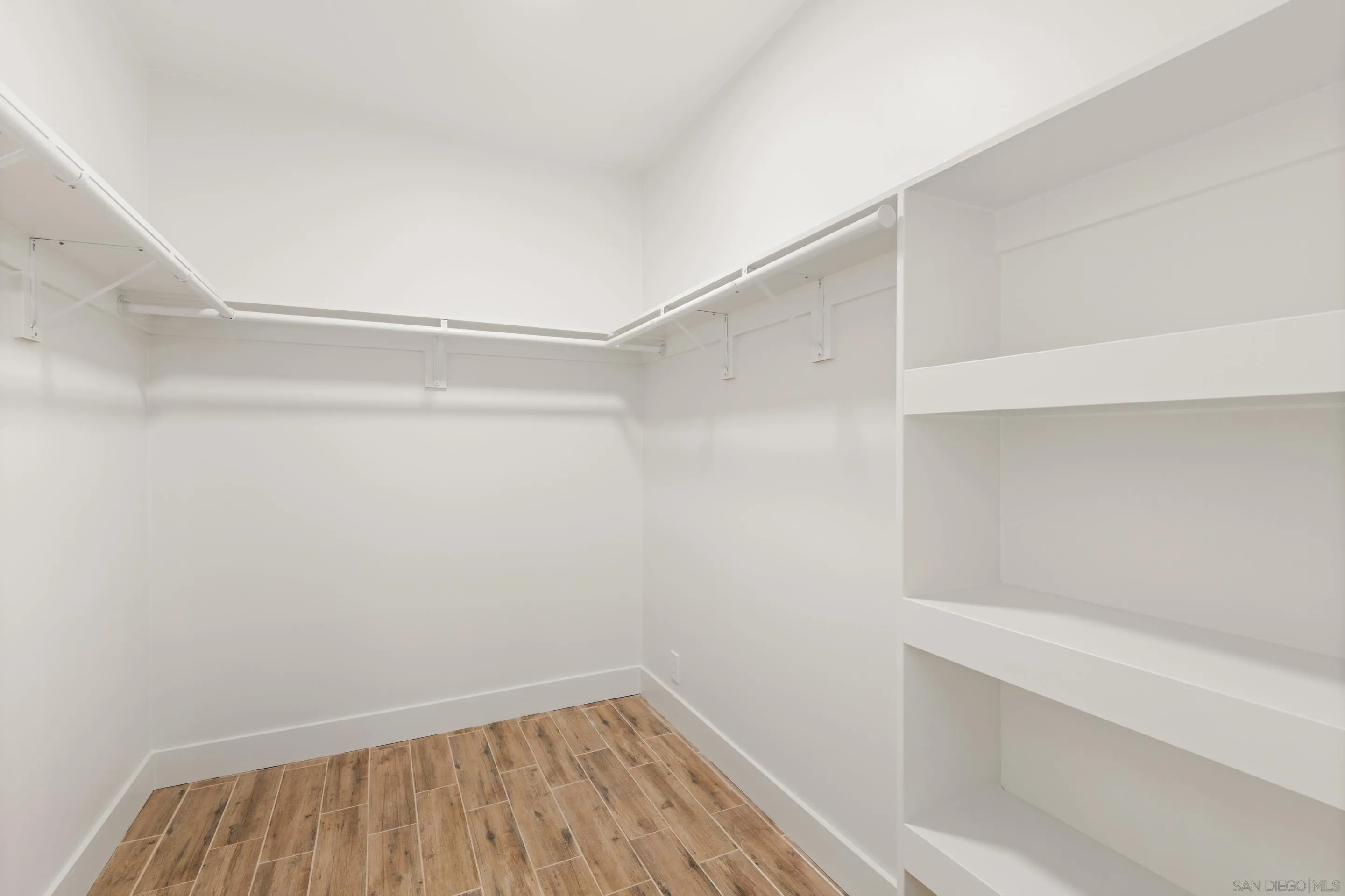 9767 Claiborne Square La Jolla, CA 92037 - Photo 21 of 50 a view of an empty walk in closet