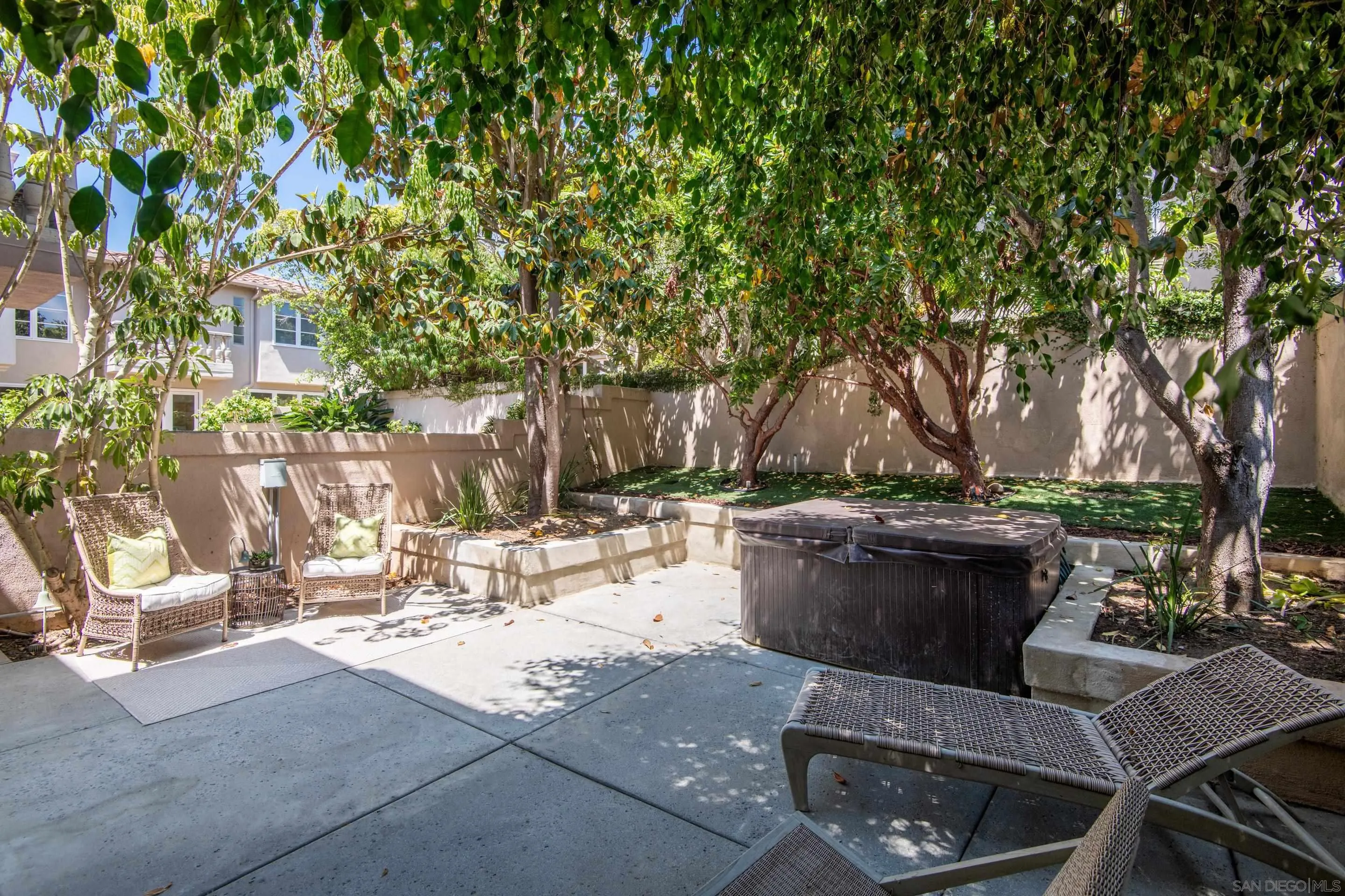 9767 Claiborne Square La Jolla, CA 92037 - Photo 27 of 50 a view of a backyard with sitting area