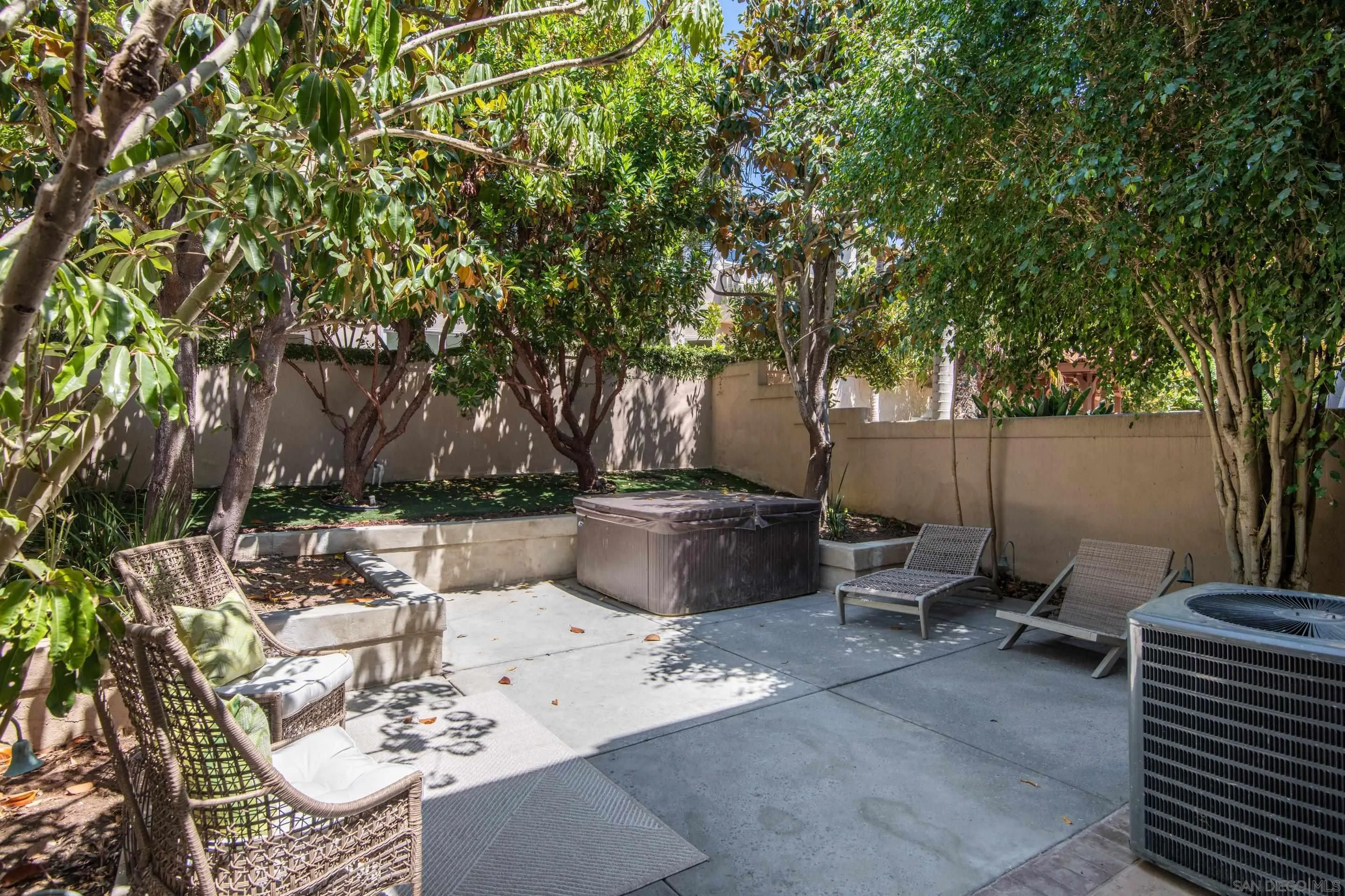 9767 Claiborne Square La Jolla, CA 92037 - Photo 29 of 50 a backyard of a house with table and chairs