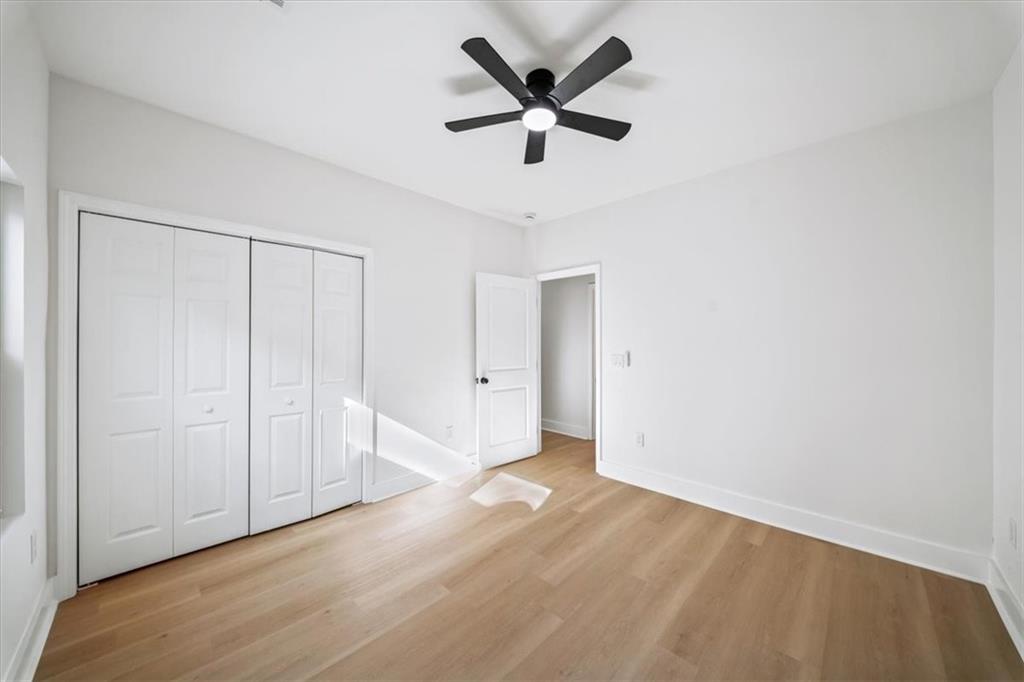 1523 Melrose Drive Southwest Atlanta, GA 30310 - Photo 18 of 33 an empty room with ceiling fan and window
