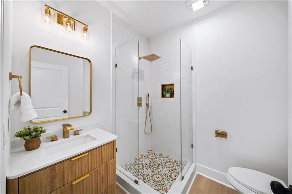 1523 Melrose Drive Southwest Atlanta, GA 30310 - Photo 19 of 33 a bathroom with a sink a toilet and shower