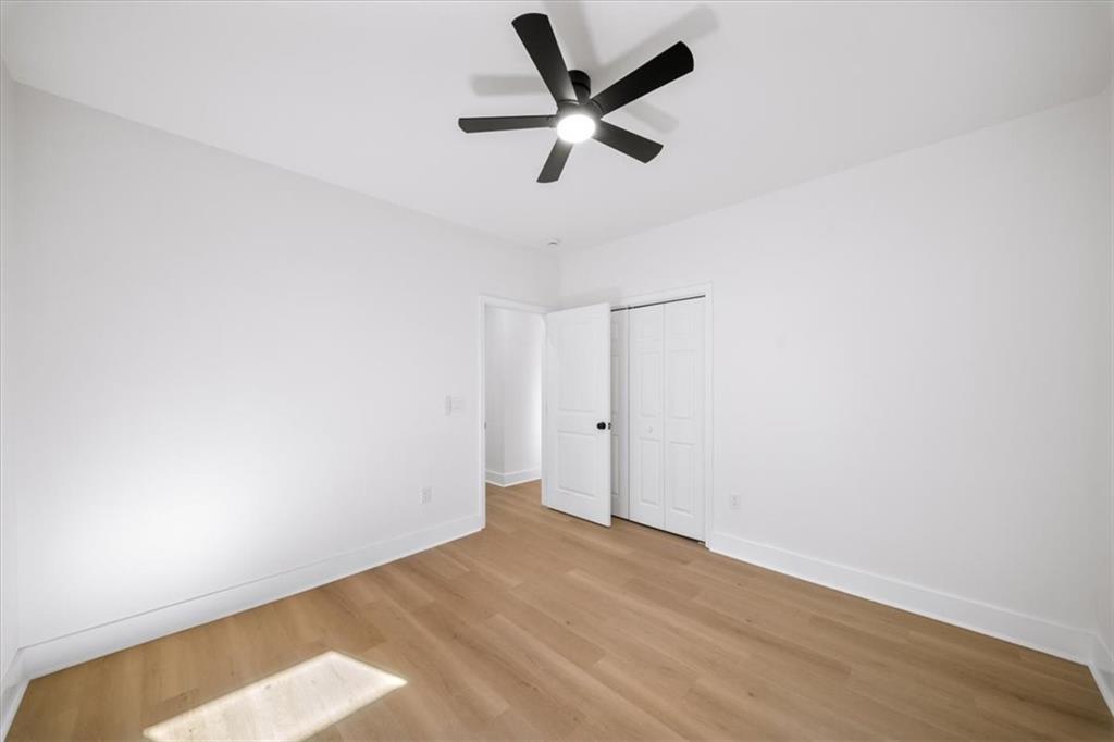 1523 Melrose Drive Southwest Atlanta, GA 30310 - Photo 21 of 33 a view of empty room with ceiling fan