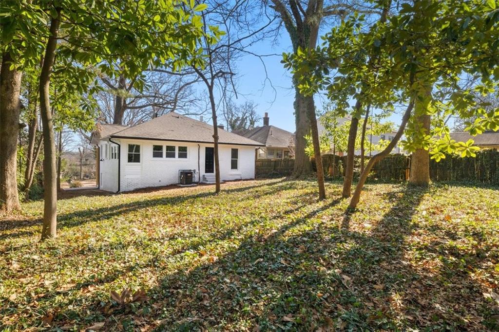 1523 Melrose Drive Southwest Atlanta, GA 30310 - Photo 23 of 33 a house with trees in front of it