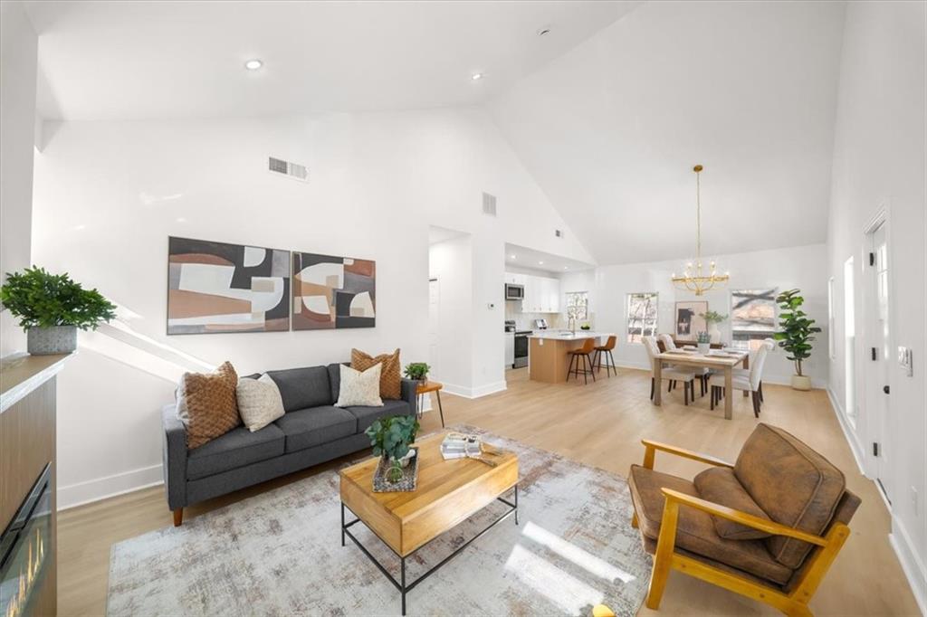 1523 Melrose Drive Southwest Atlanta, GA 30310 - Photo 4 of 33 a living room with furniture and a chandelier