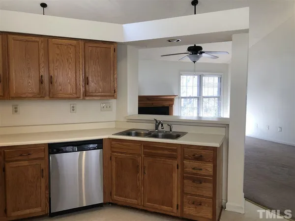 a kitchen with a sink and cabinets