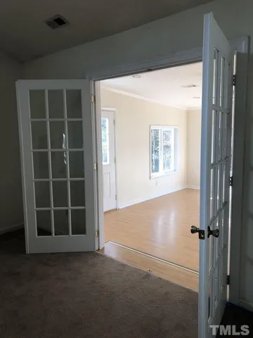 a view of an empty room with a window