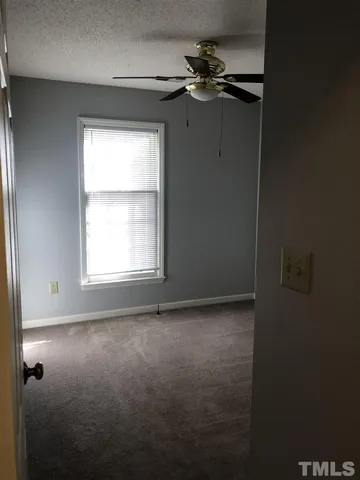 a view of empty room with windows