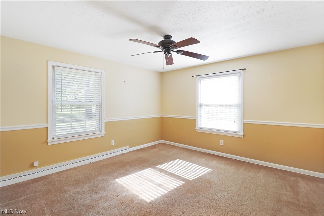 145 Waterloo Road Mogadore, OH 44260 - Photo 10 of 17 First floor bedroom with carpet and lots of natural light