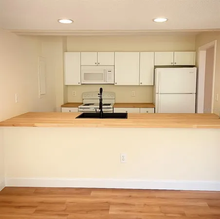 a view of a kitchen with a sink