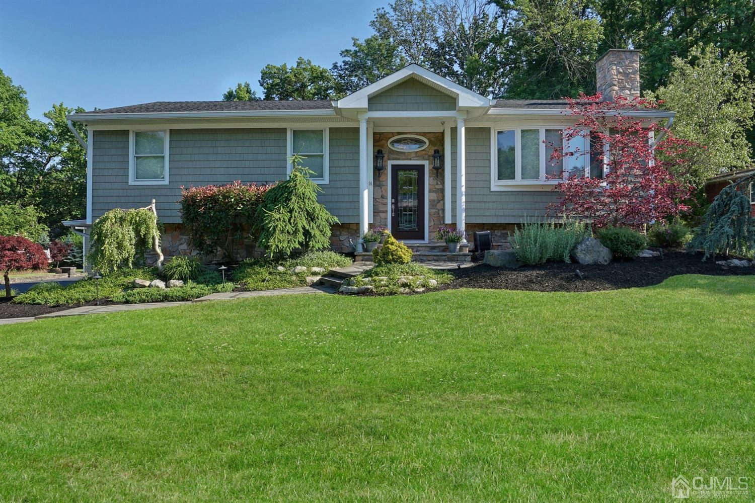14 Fishel Road Edison, NJ 08820 - Photo 1 of 46 a front view of a house with a garden