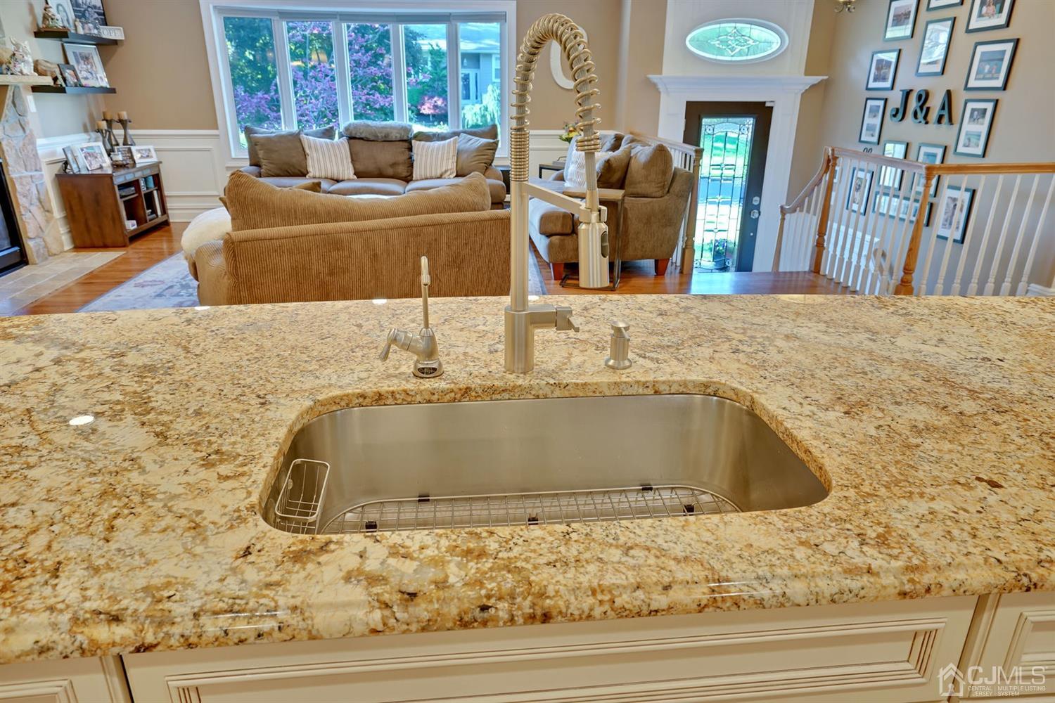 14 Fishel Road Edison, NJ 08820 - Photo 14 of 46 a bathroom with a granite countertop sink and washing machine