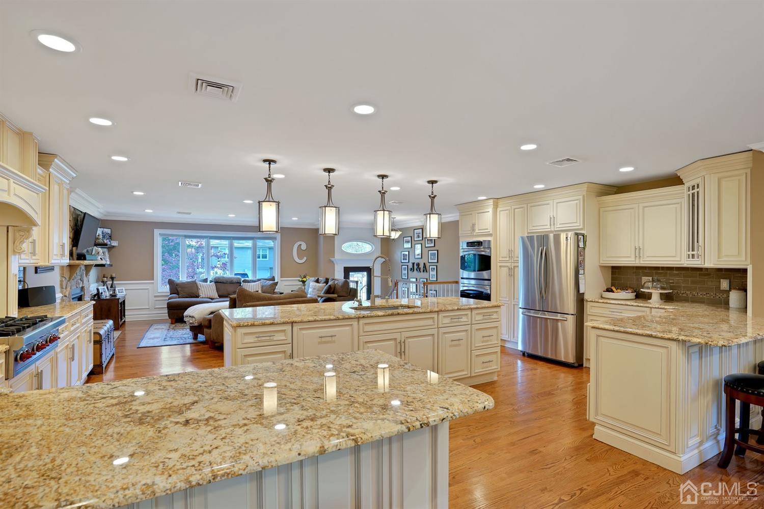 14 Fishel Road Edison, NJ 08820 - Photo 16 of 46 a large kitchen with stainless steel appliances lots of counter space and a refrigerator