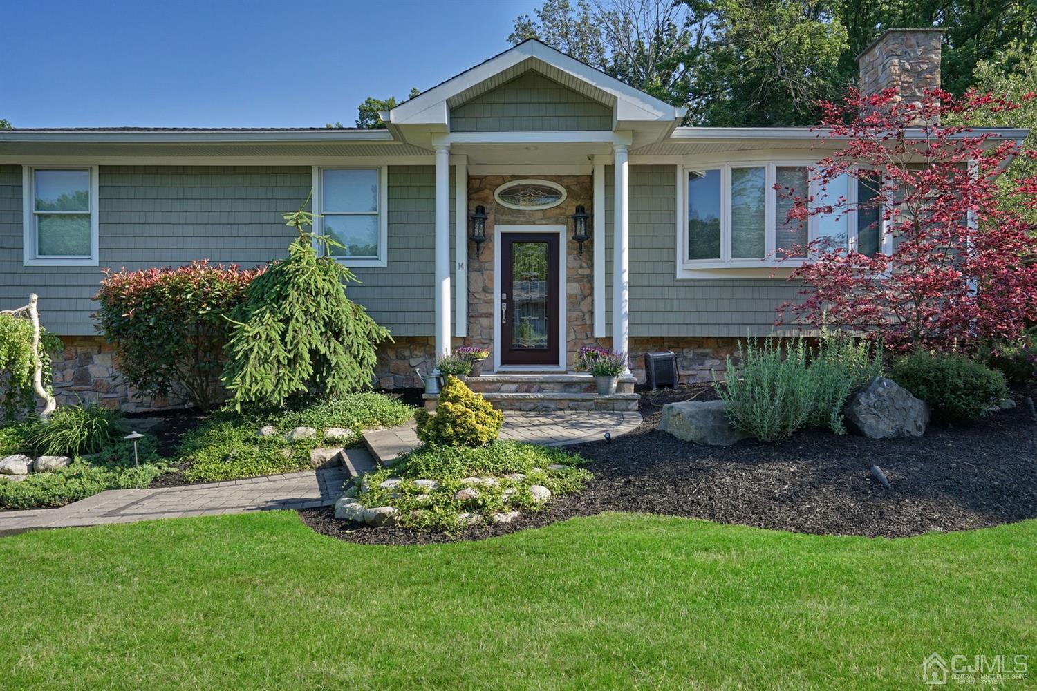 14 Fishel Road Edison, NJ 08820 - Photo 3 of 46 a front view of a house with a garden