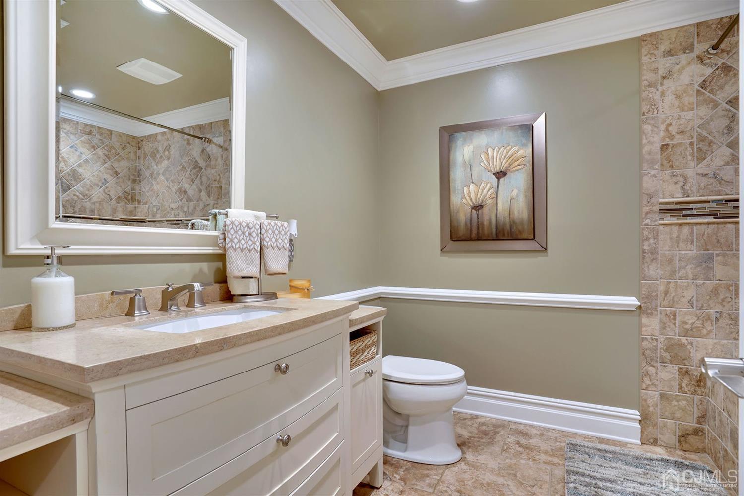 14 Fishel Road Edison, NJ 08820 - Photo 24 of 46 a bathroom with a toilet sink and mirror