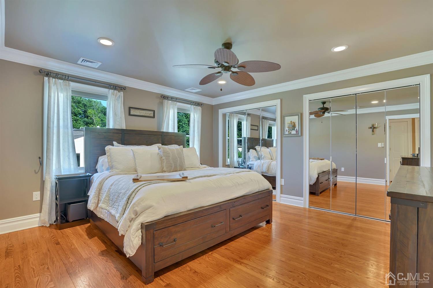 14 Fishel Road Edison, NJ 08820 - Photo 26 of 46 a spacious bedroom with a bed and a chandelier