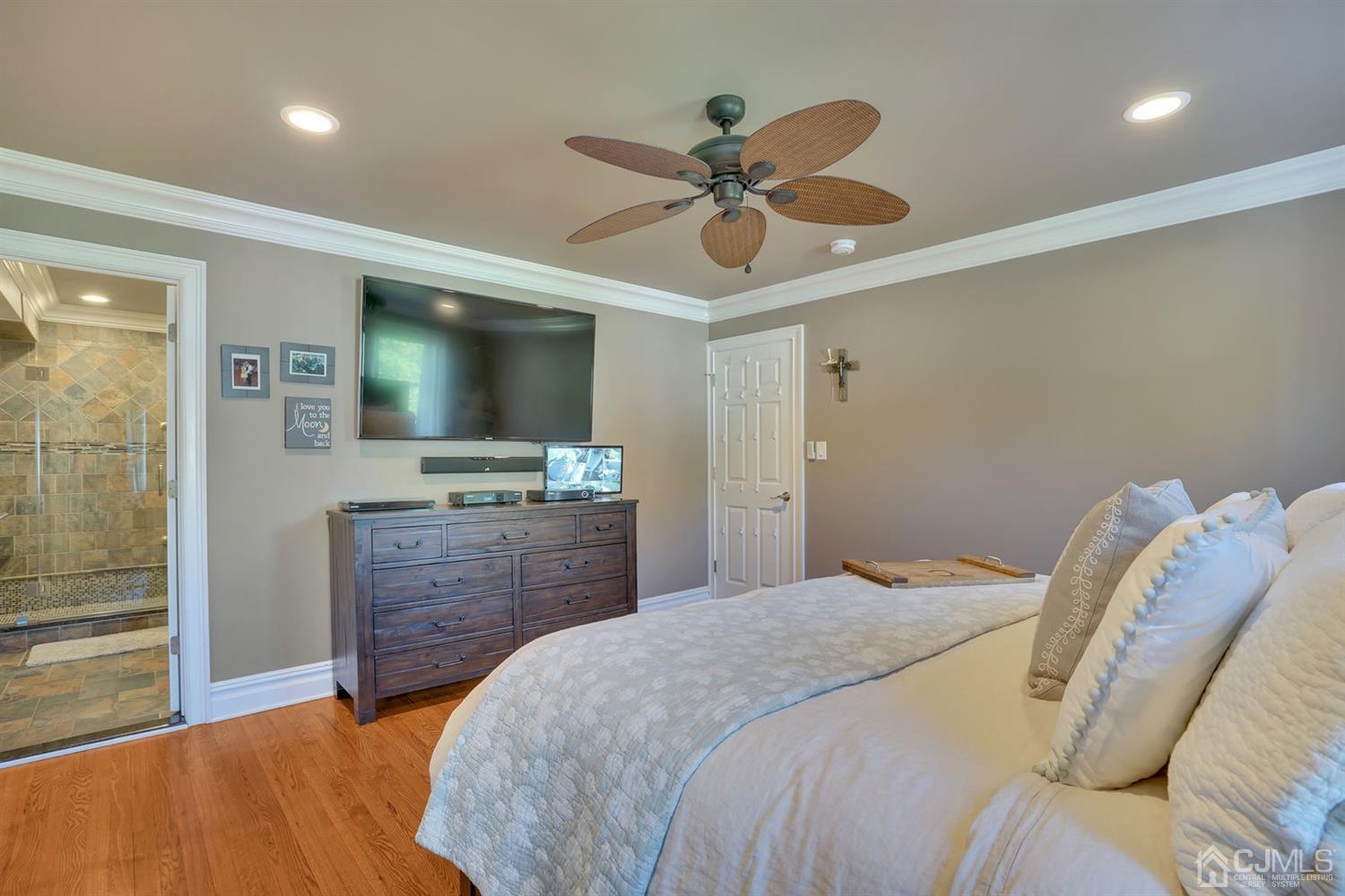 14 Fishel Road Edison, NJ 08820 - Photo 27 of 46 a bedroom with a bed and a flat screen tv