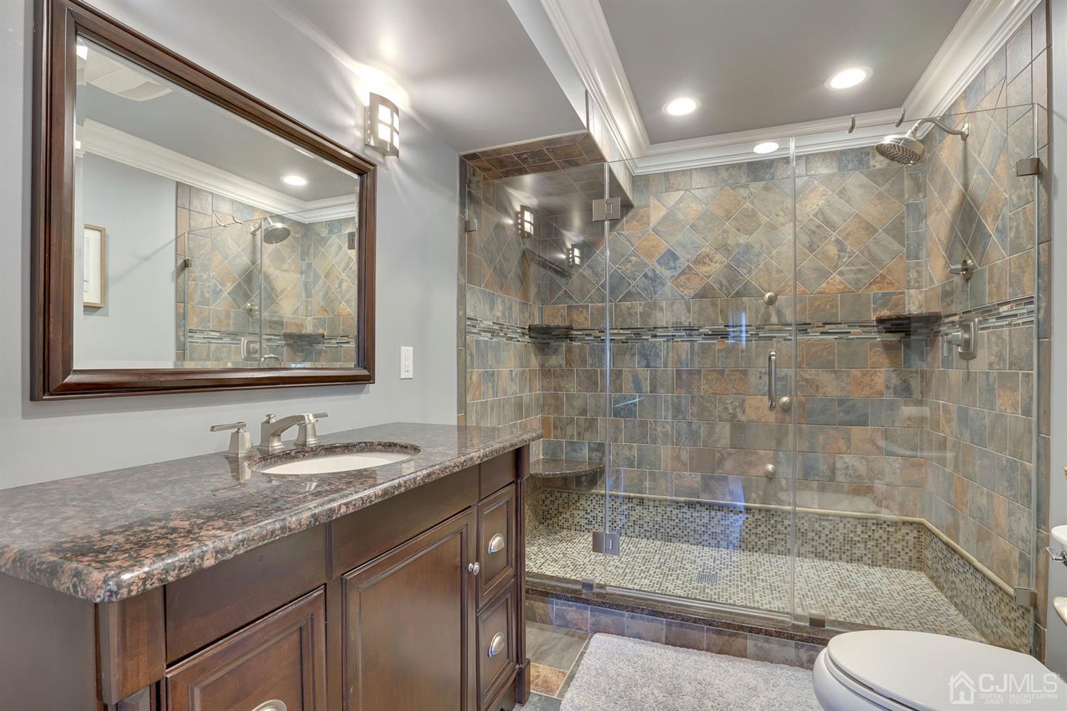 14 Fishel Road Edison, NJ 08820 - Photo 28 of 46 a bathroom with a granite countertop sink toilet and shower