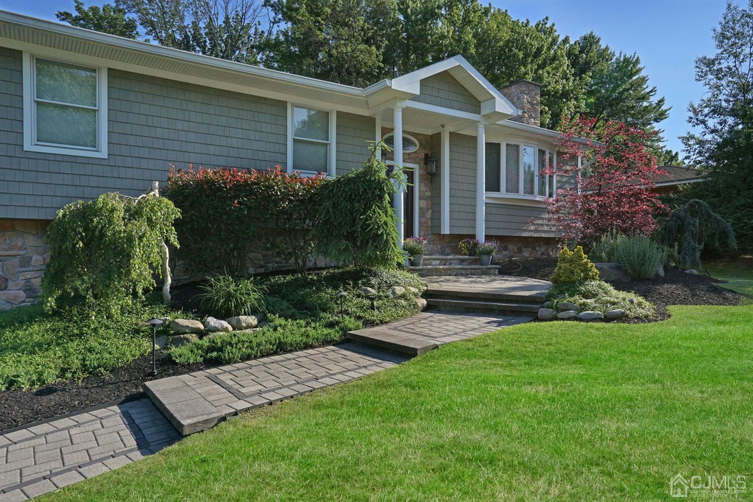 14 Fishel Road Edison, NJ 08820 - Photo 4 of 46 a view of a house with a yard and plants