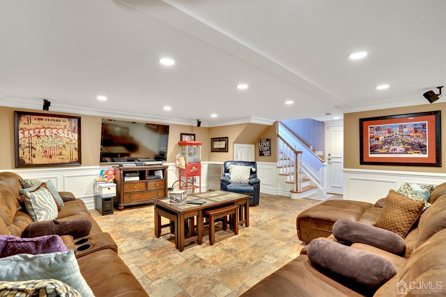 14 Fishel Road Edison, NJ 08820 - Photo 31 of 46 a living room with furniture and a flat screen tv