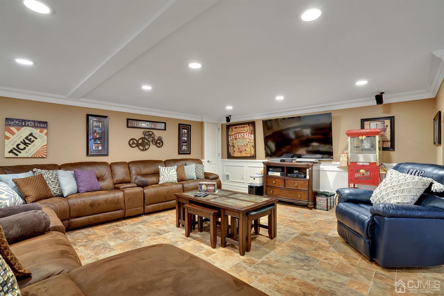 14 Fishel Road Edison, NJ 08820 - Photo 33 of 46 a living room with furniture and a flat screen tv
