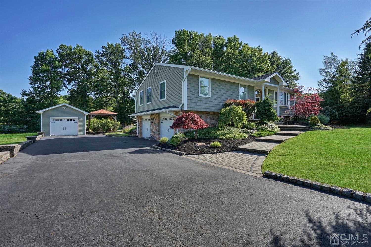 14 Fishel Road Edison, NJ 08820 - Photo 35 of 46 a front view of house with a yard and outdoor seating