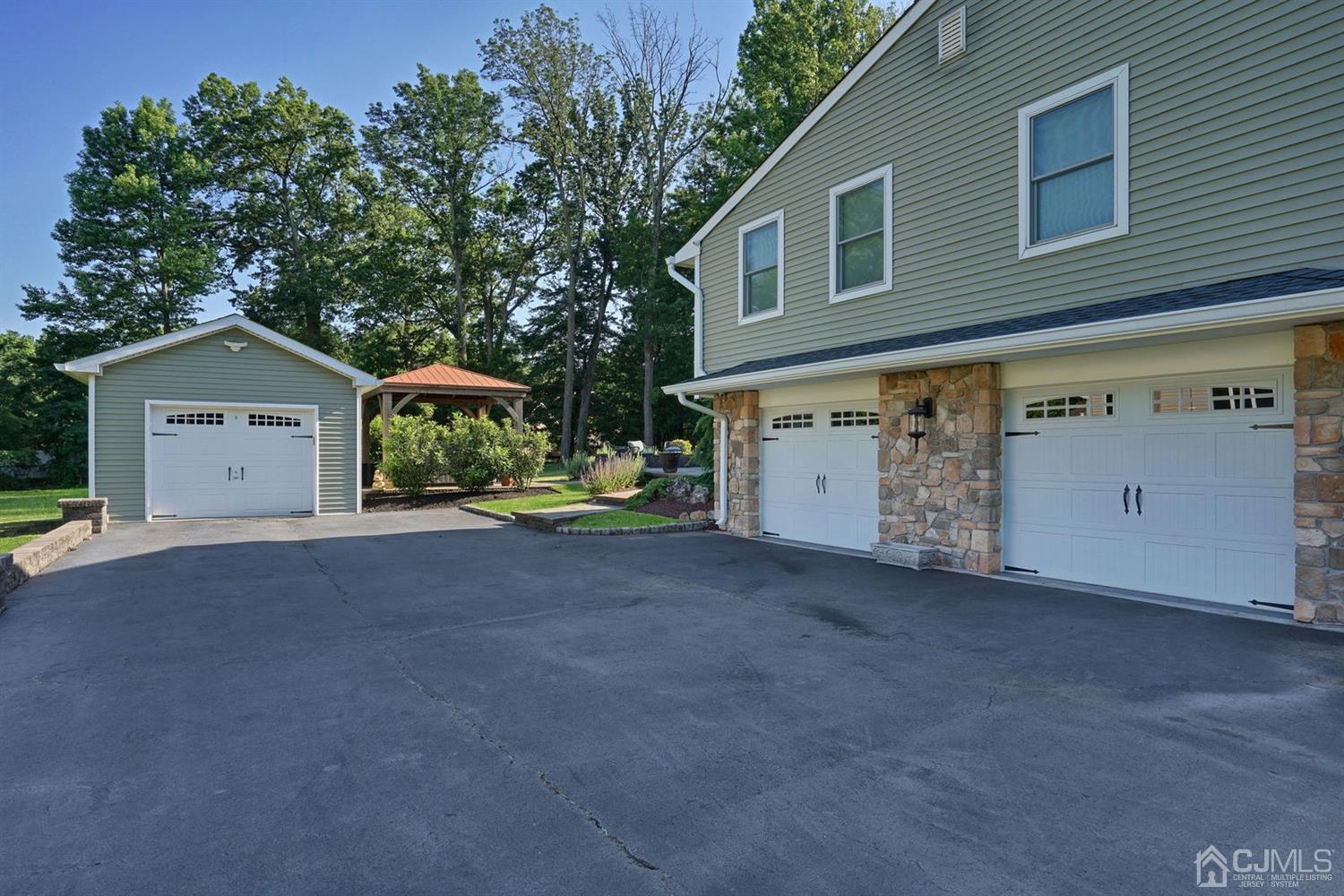 14 Fishel Road Edison, NJ 08820 - Photo 36 of 46 a view of a house with a outdoor space and garage