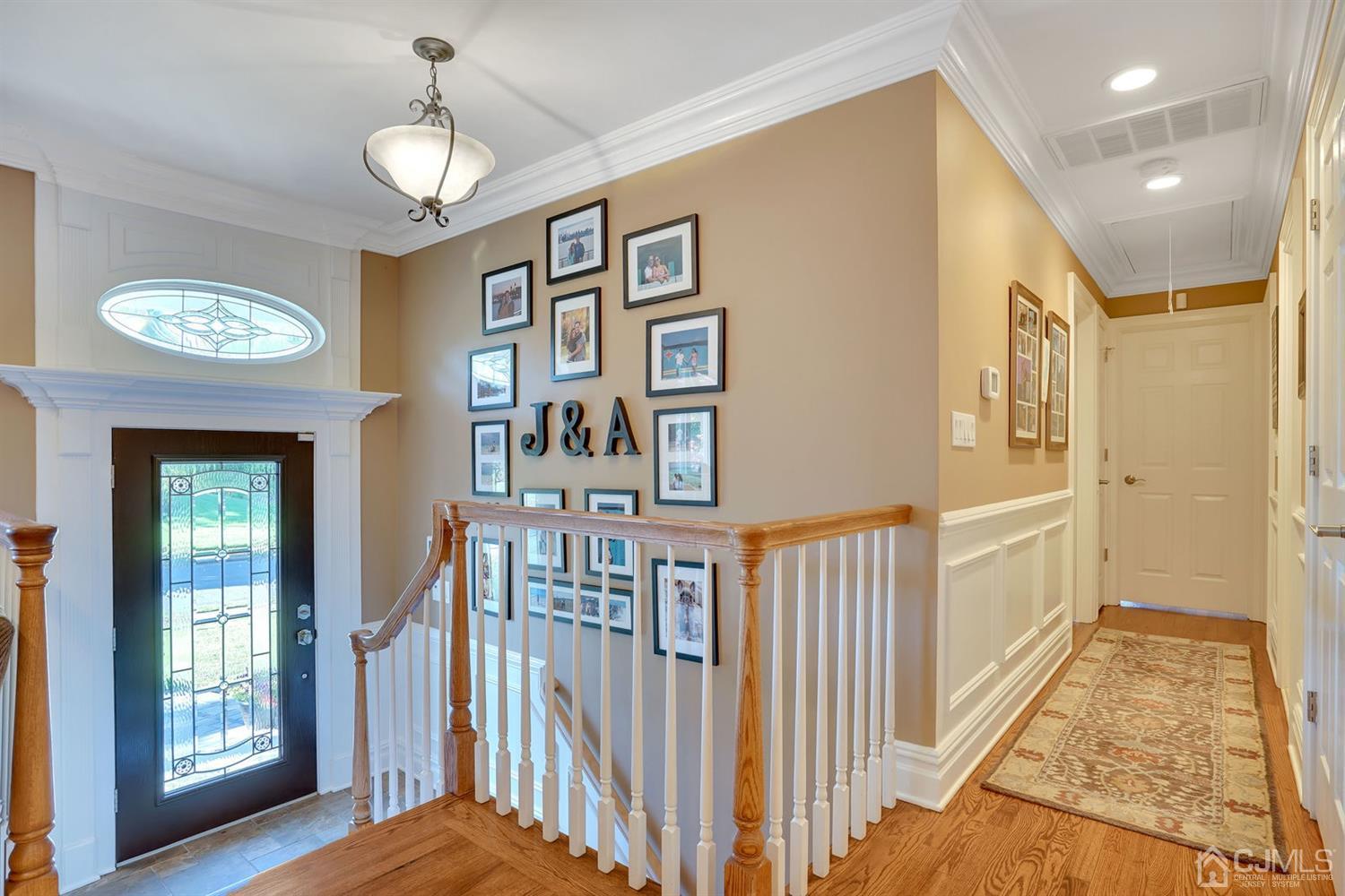 14 Fishel Road Edison, NJ 08820 - Photo 5 of 46 a view of a hallway with entryway windows wooden floor and front door