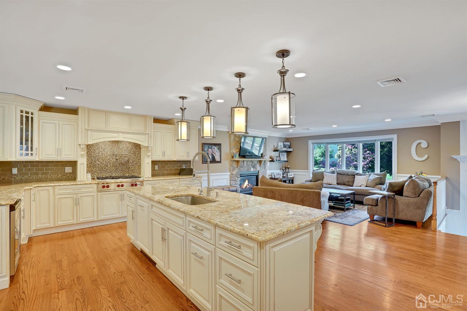 14 Fishel Road Edison, NJ 08820 - Photo 10 of 46 a large kitchen with kitchen island a large counter space appliances and a center island