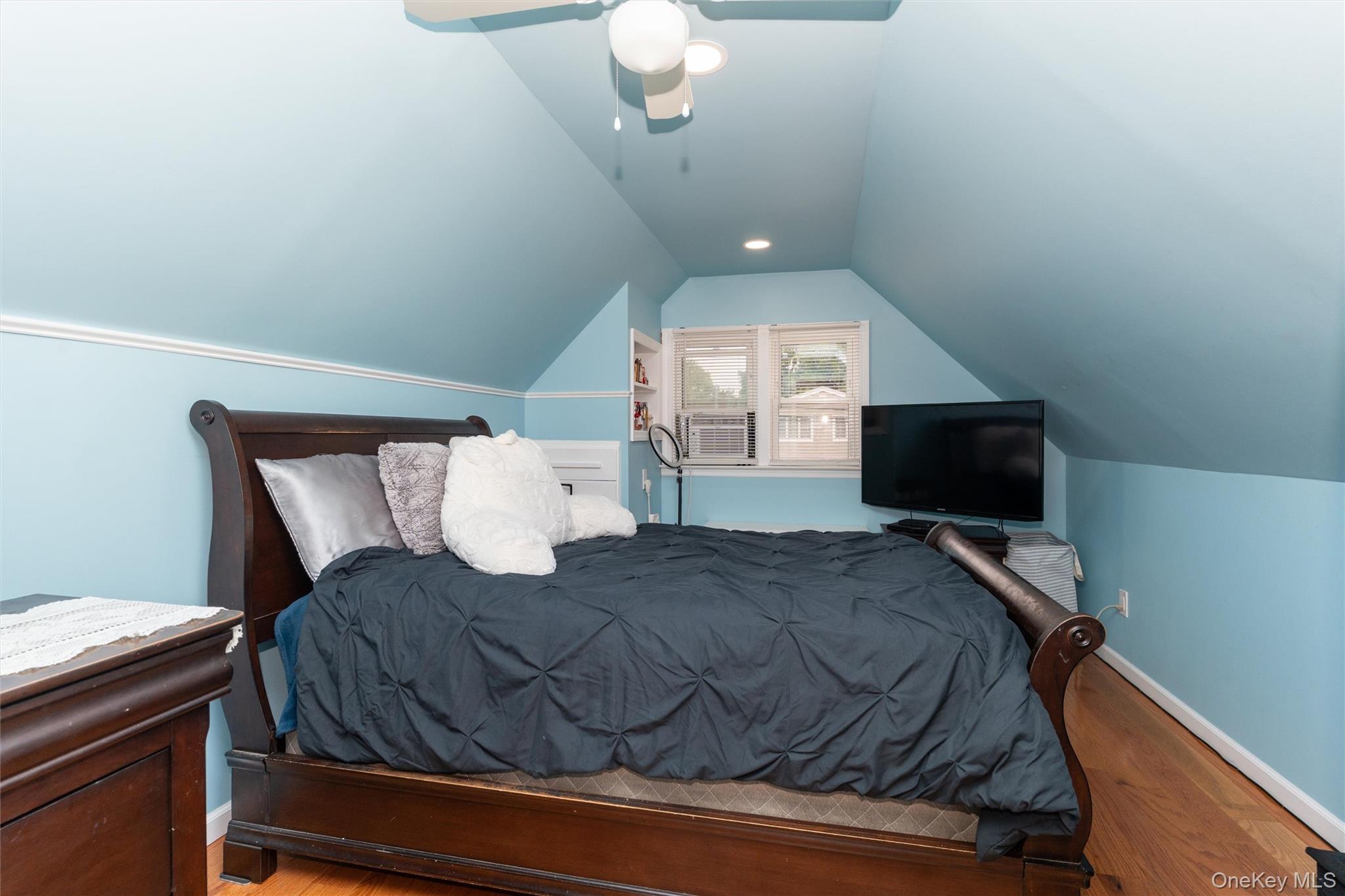 6 Jasper Street Valley Stream, NY 11580 - Photo 11 of 19 a bedroom with a bed and a flat screen tv