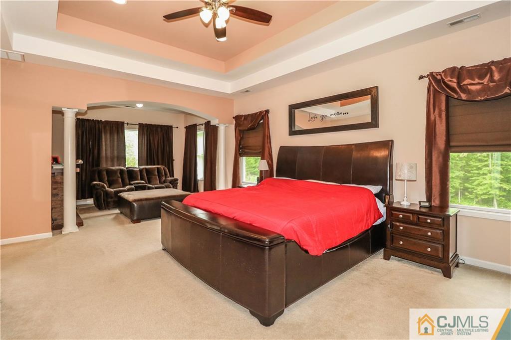 141 Westley Road Old Bridge, NJ 08857 - Photo 13 of 24 a bed room with a bed and a large closet