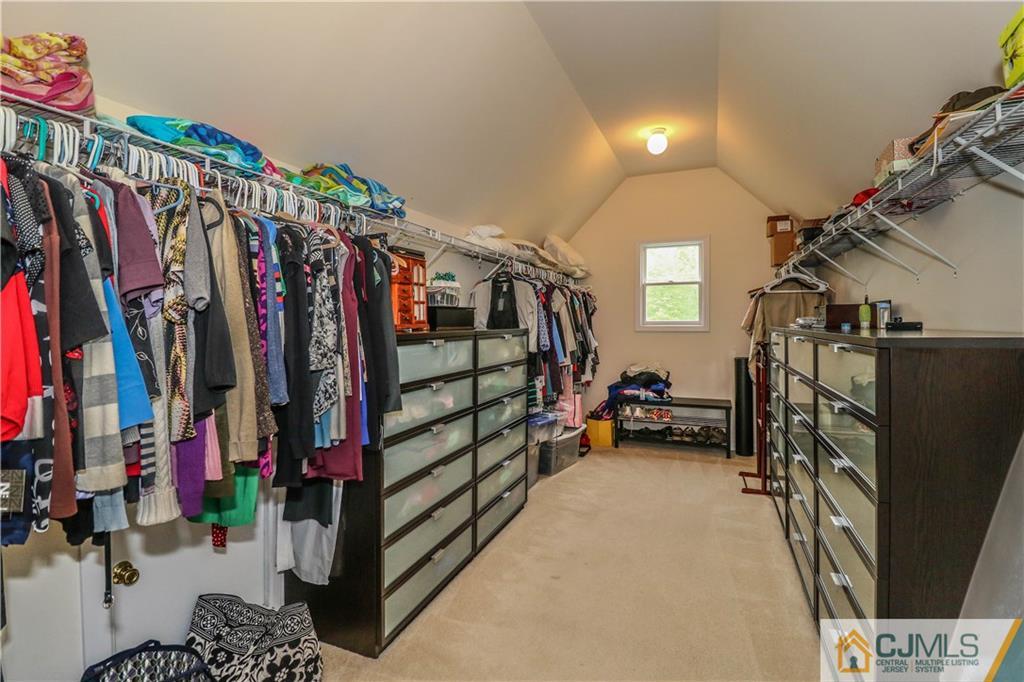 141 Westley Road Old Bridge, NJ 08857 - Photo 16 of 24 a view of walk in closet with clothes