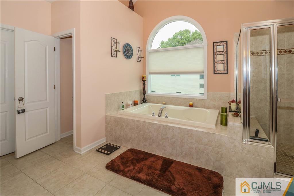141 Westley Road Old Bridge, NJ 08857 - Photo 18 of 24 a spacious bathroom with a tub and a window