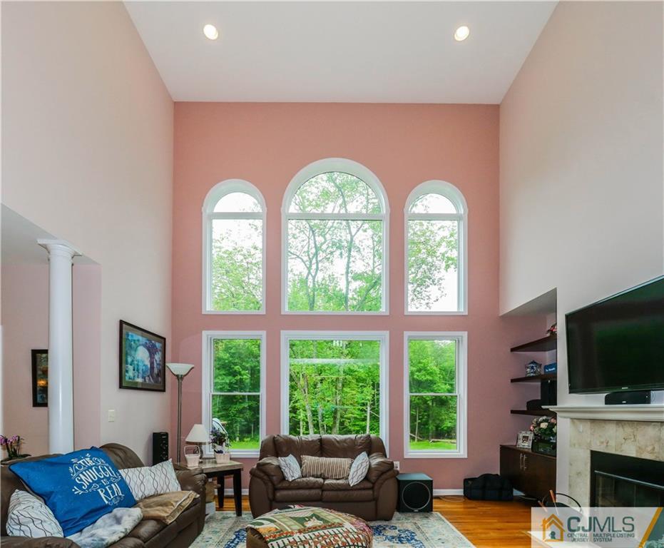 141 Westley Road Old Bridge, NJ 08857 - Photo 6 of 24 a living room with fireplace furniture and a large window
