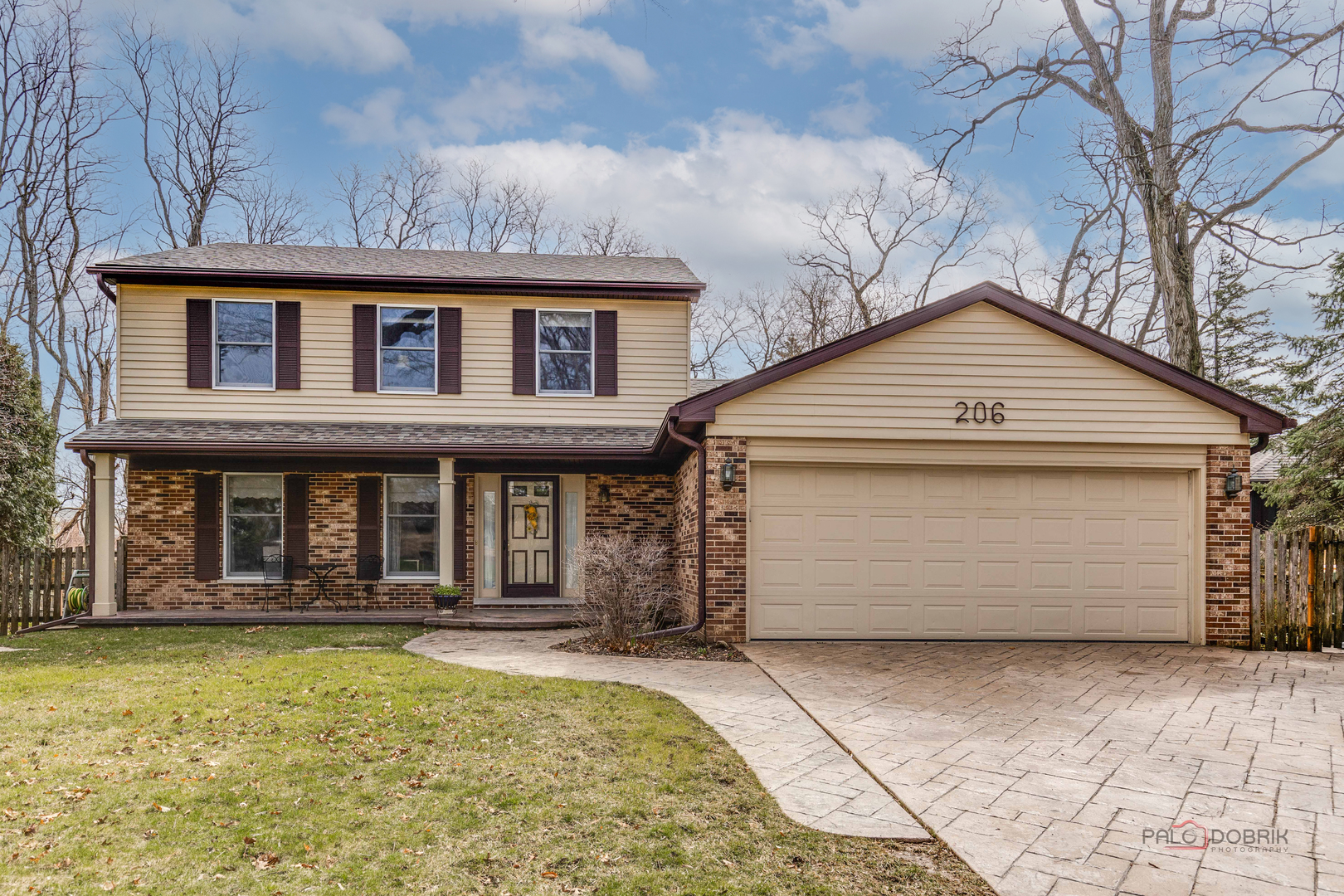 206 Pond Ridge Road Libertyville, IL 60048 - Photo 1 of 42 a front view of a house with parking