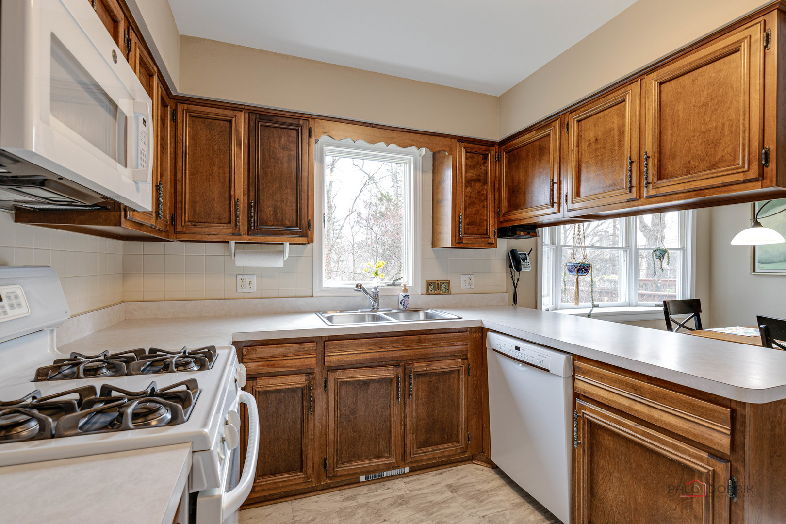 206 Pond Ridge Road Libertyville, IL 60048 - Photo 11 of 42 a kitchen with a sink stove top oven and cabinets