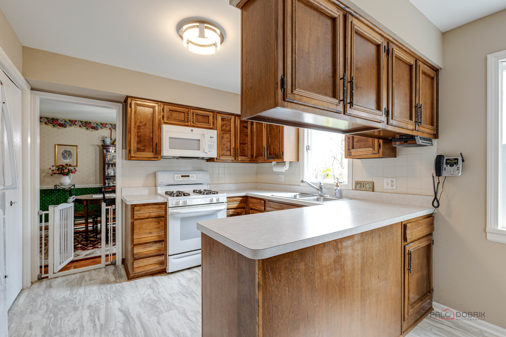 206 Pond Ridge Road Libertyville, IL 60048 - Photo 13 of 42 a kitchen with stainless steel appliances granite countertop a sink stove and cabinets