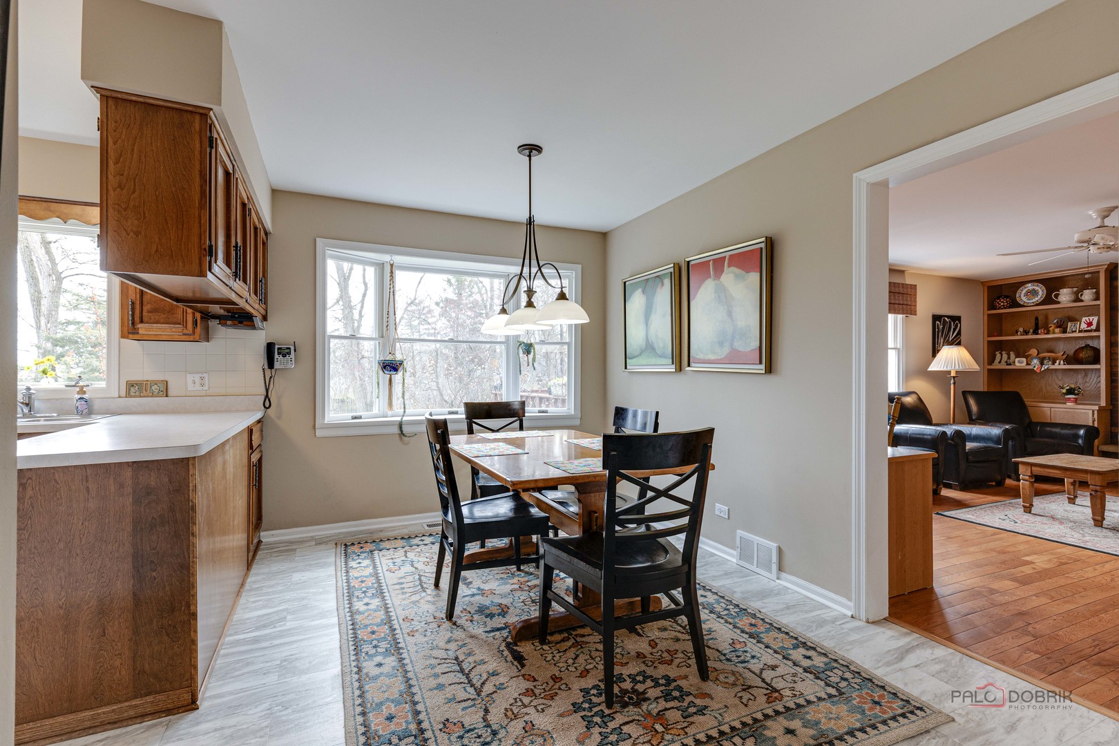 206 Pond Ridge Road Libertyville, IL 60048 - Photo 14 of 42 a view of a dining room with furniture window and wooden floor