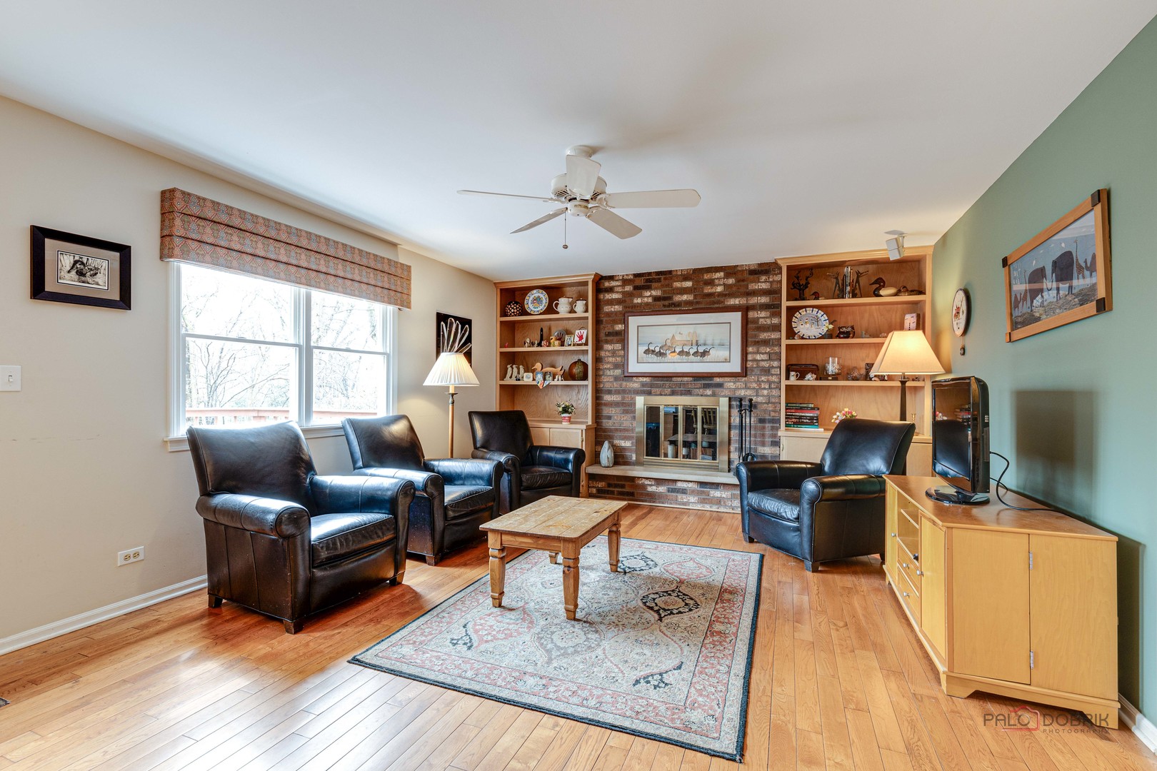 206 Pond Ridge Road Libertyville, IL 60048 - Photo 15 of 42 a living room with furniture a rug and a flat screen tv