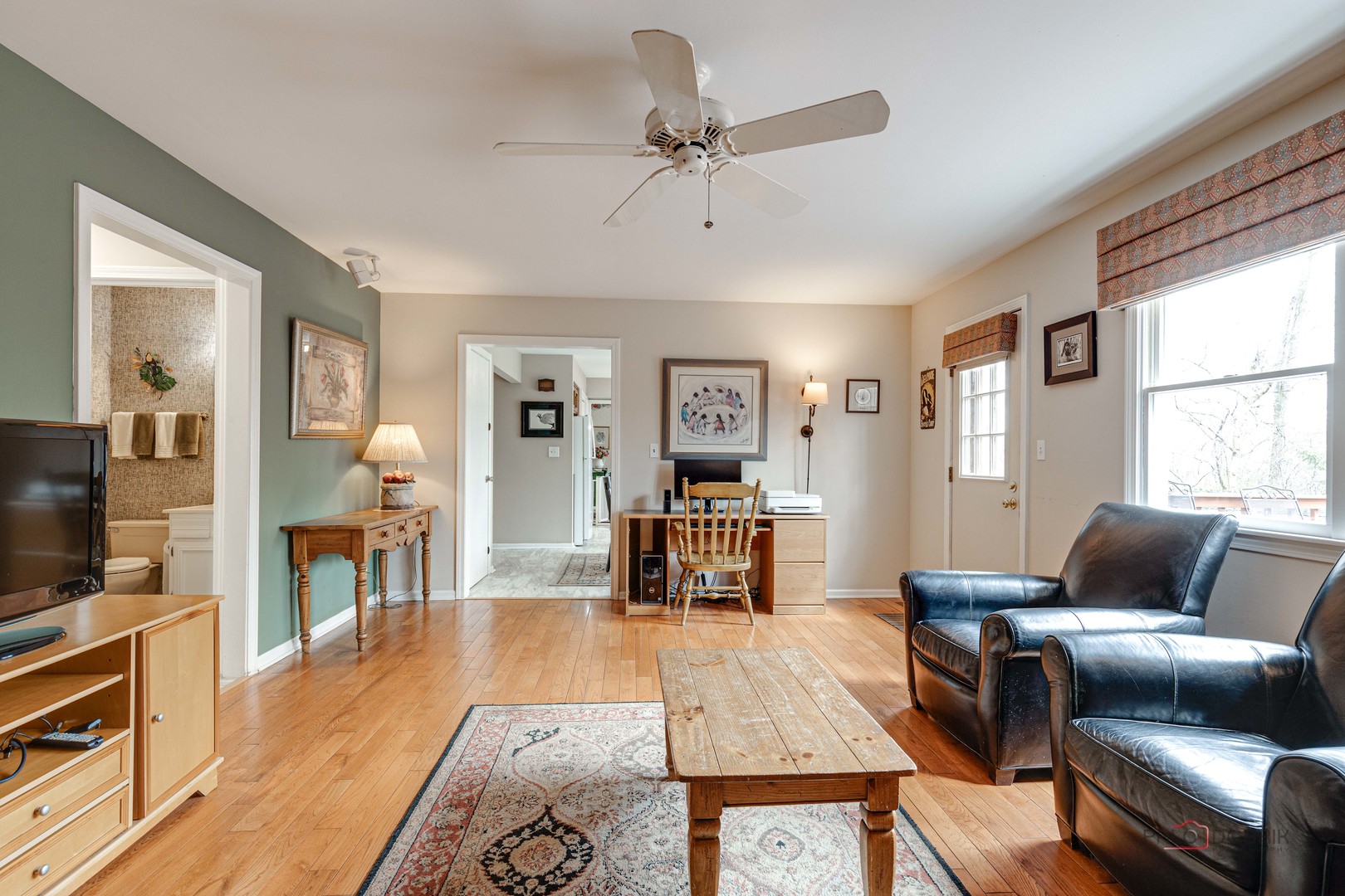 206 Pond Ridge Road Libertyville, IL 60048 - Photo 16 of 42 a living room with furniture and a flat screen tv