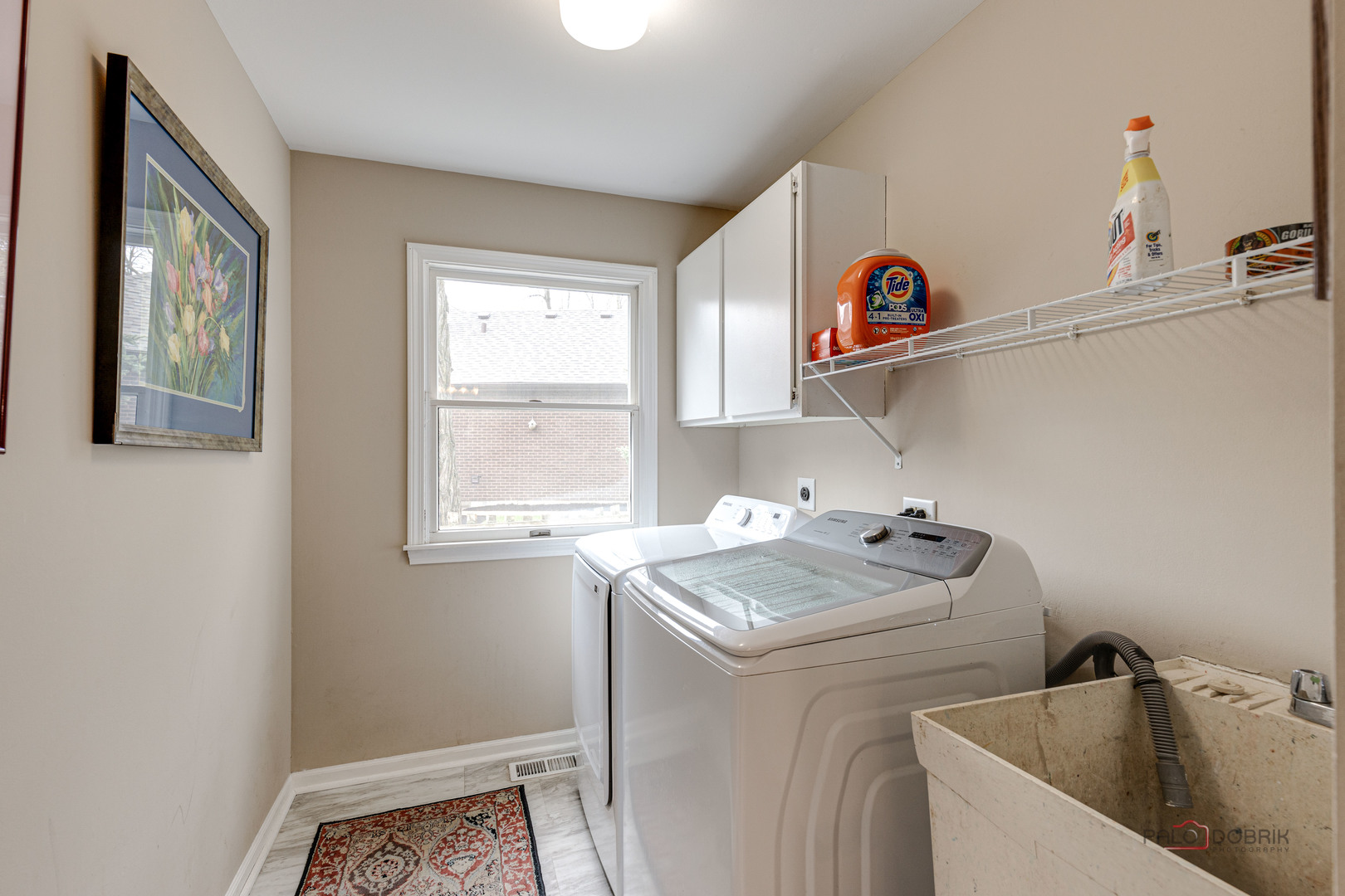 206 Pond Ridge Road Libertyville, IL 60048 - Photo 18 of 42 a utility room with dryer and window