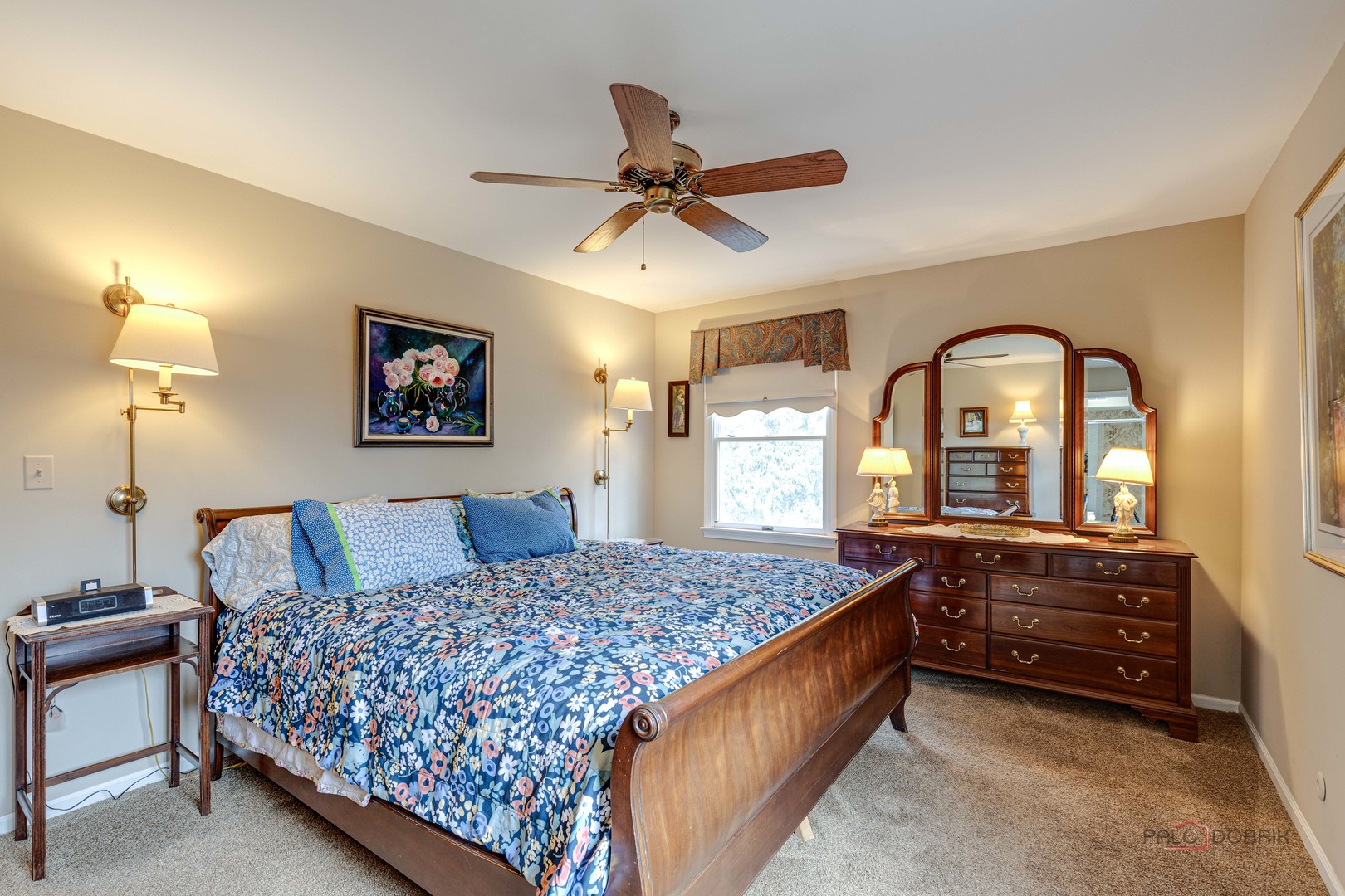 206 Pond Ridge Road Libertyville, IL 60048 - Photo 20 of 42 a bedroom with a bed and a chandelier