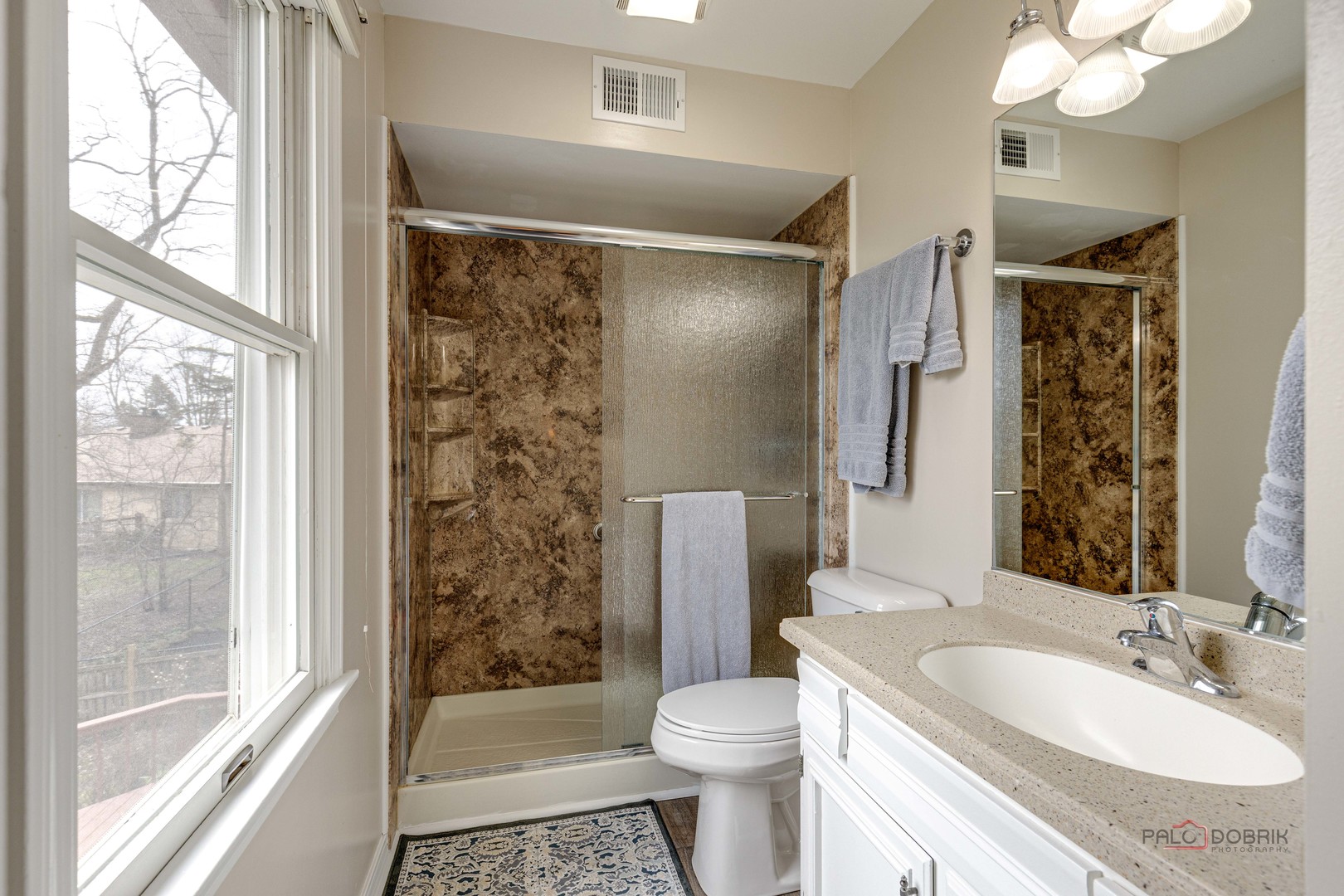 206 Pond Ridge Road Libertyville, IL 60048 - Photo 21 of 42 a bathroom with a sink toilet and shower