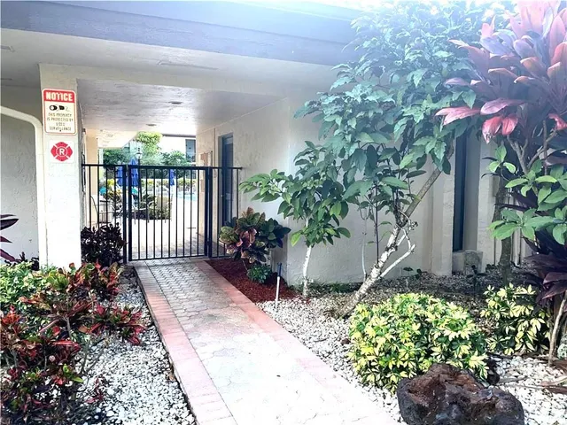 a front view of a house having yard