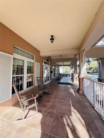 a view of a patio with table and chairs